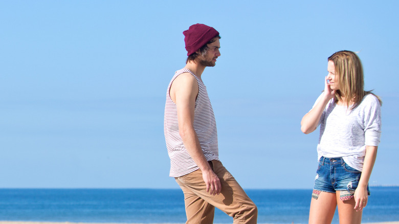 Pickup artist flirting with woman