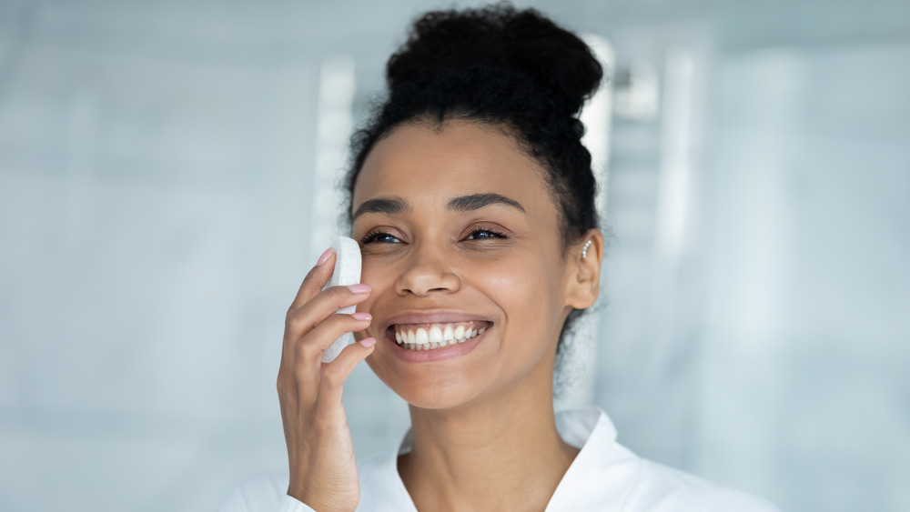 Woman cleaning skin