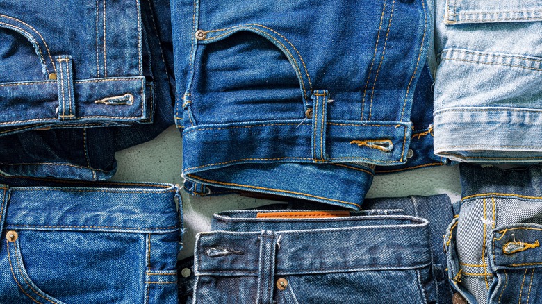 folded pairs of jeans