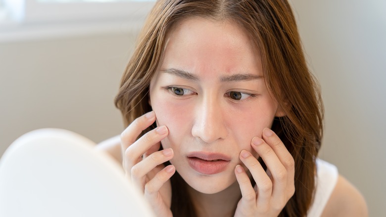 Woman with red, irritated skin