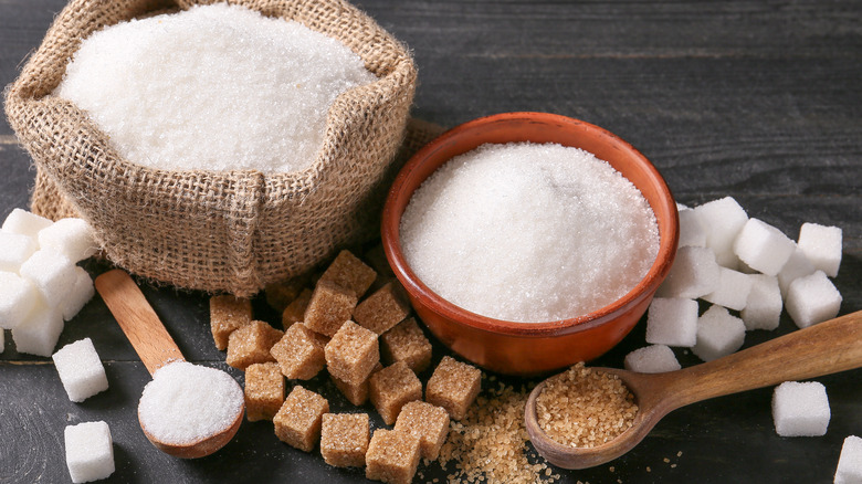 Bowls of sugar granules with sugar cubes