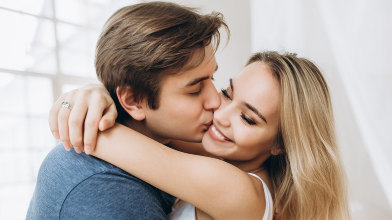 Happy couple sharing a kiss 