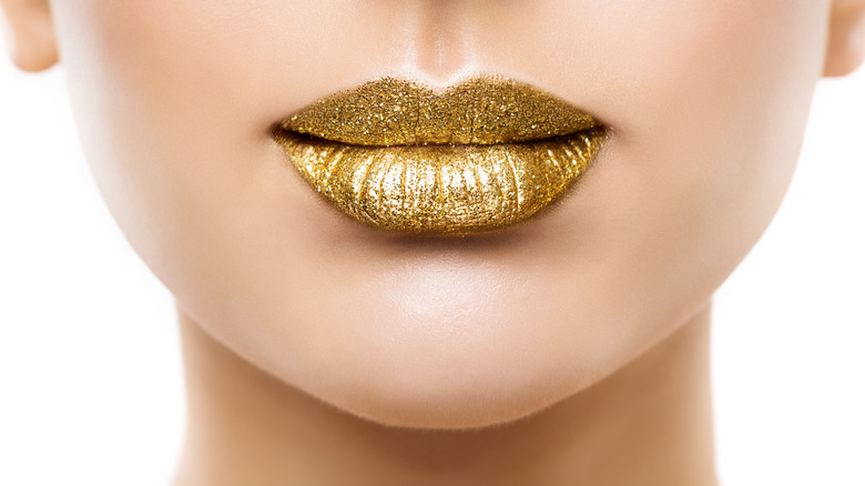 Golden glittery lipstick