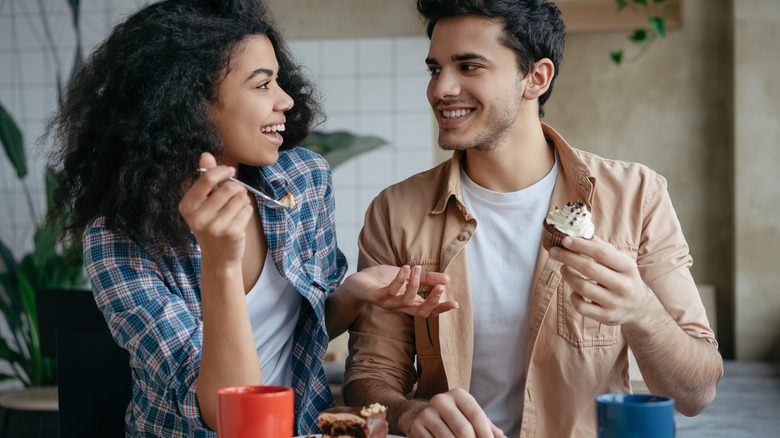 Man and woman eating together