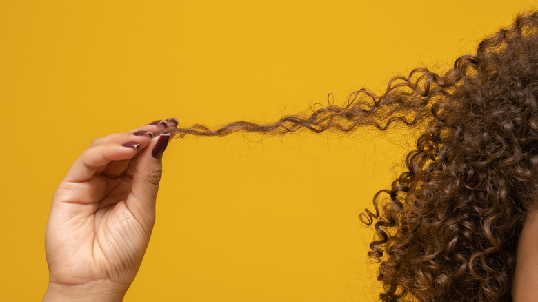 Close-up of woman pulling hair