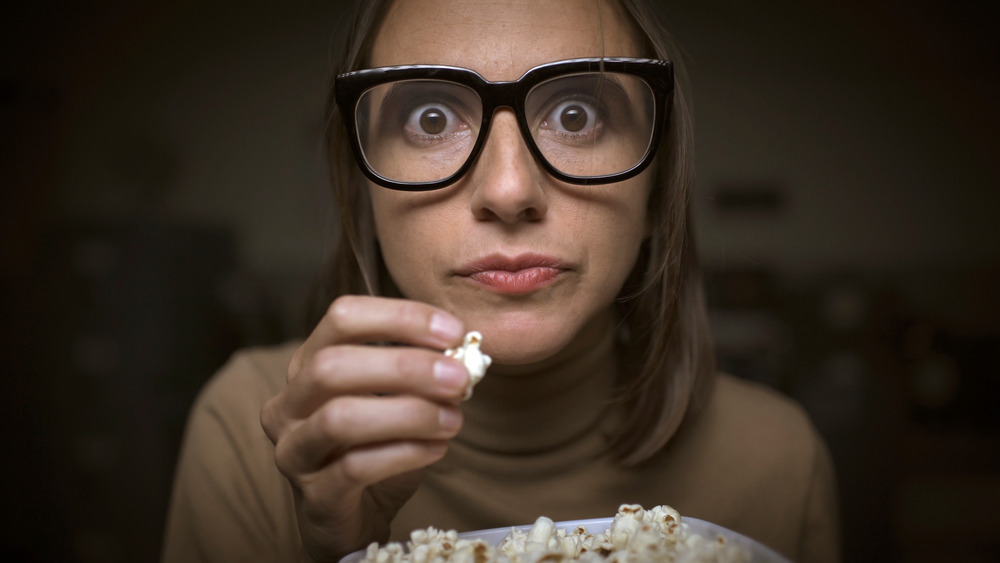 woman engrossed by TV