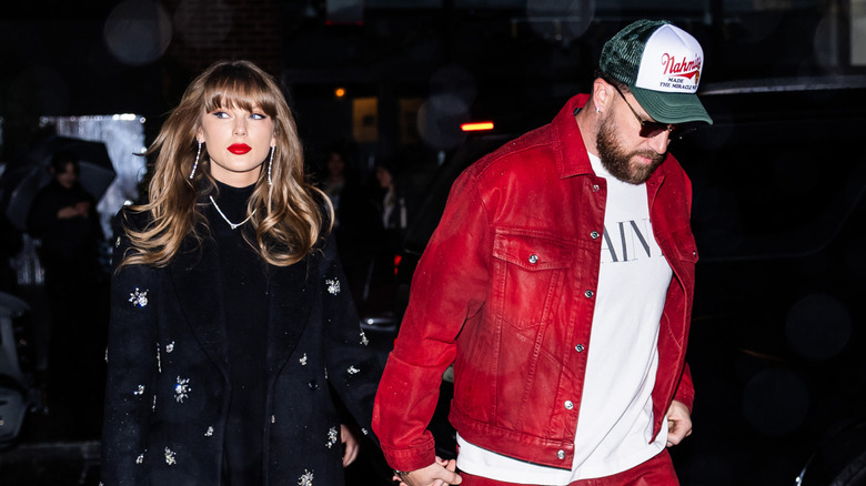 Taylor Swift and Travis Kelce holding hands