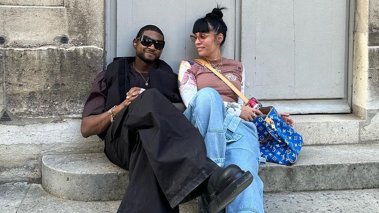 Usher and Jennifer Goicoechea sitting together