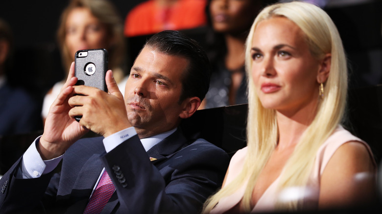 Donald Trump Jr. on phone next to Vanessa