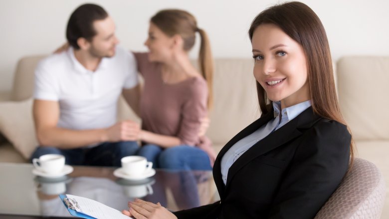 wedding planner with couple in background