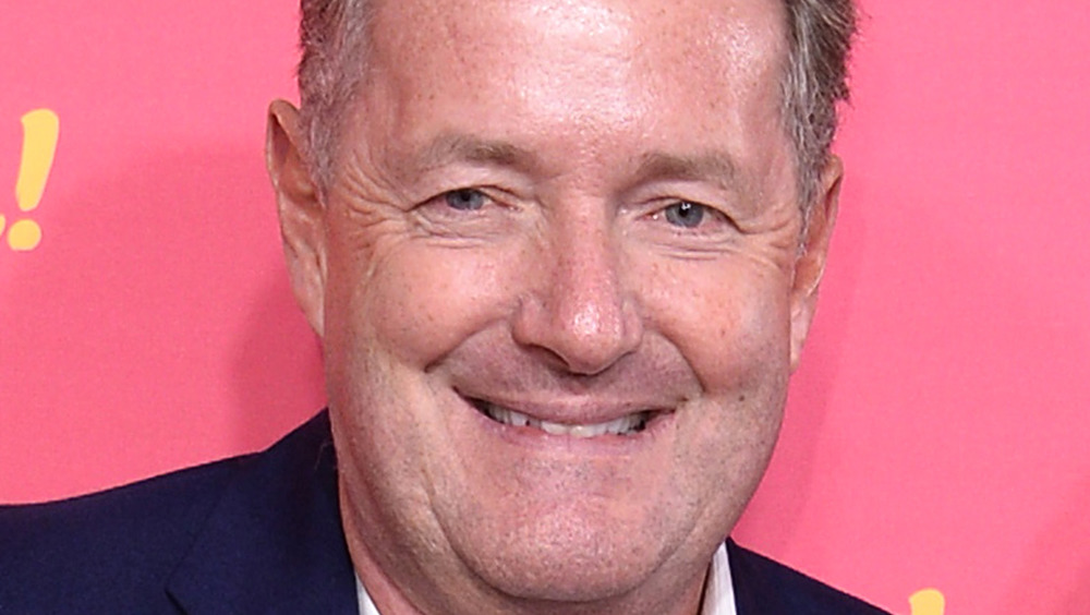 Piers Morgan pink background