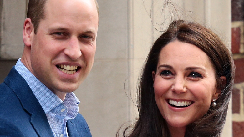 William and Kate smiling at cameras