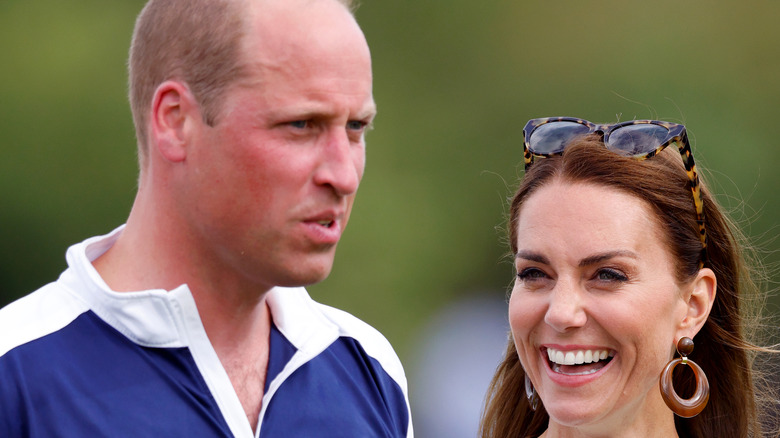 Prince William walks with Catherine after polo