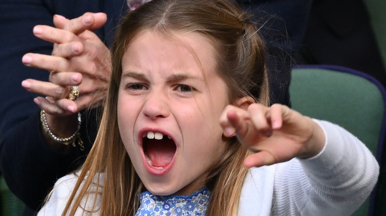 Princess Charlotte shouting with fingers crossed