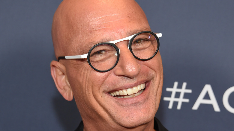 Howie Mandel poses on the red carpet. 
