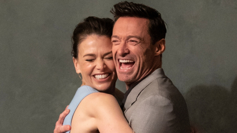 Hugh Jackman and Sutton Foster hugging for a photo in 2022