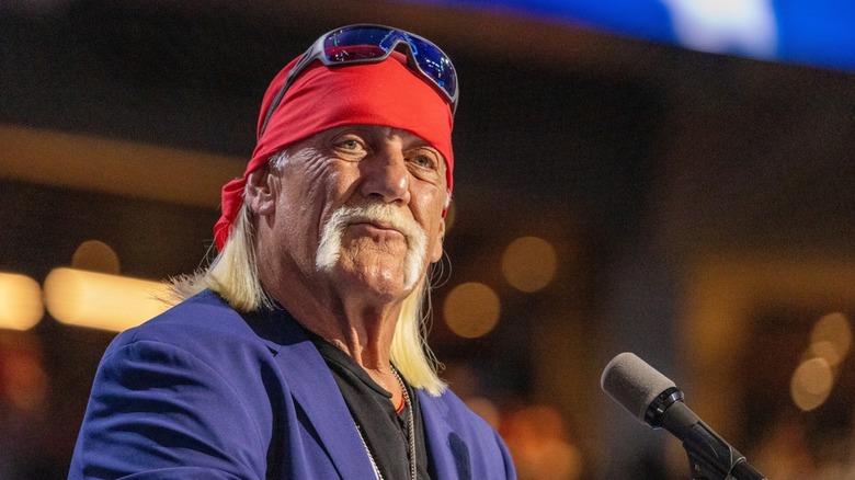 Hulk Hogan standing at a microphone