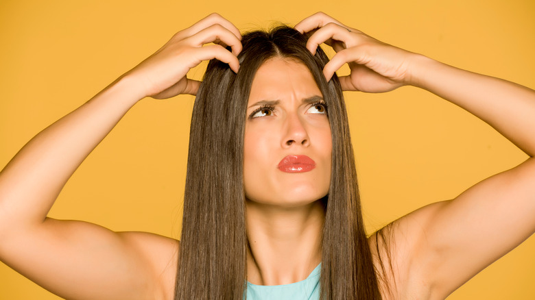 Woman with an itchy scalp