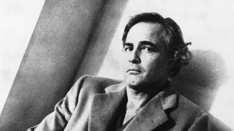 Marlon Brando leaning on a wall in 1972's 