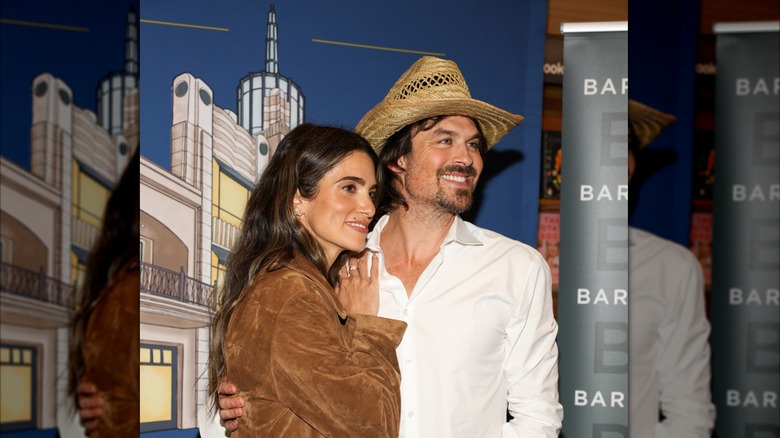 Ian Somerhalder and Nikki Reed smiling at an event