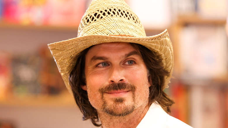 Ian Somerhalder wearing a straw cowboy hat