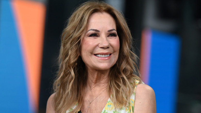 Close-up of Kathie Lee Gifford wearing a white and yellow floral print dress