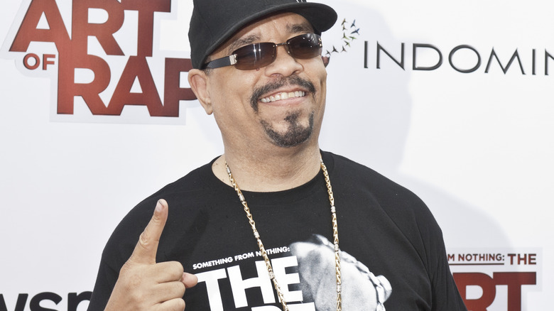 Ice-T holds up a finger on the red carpet
