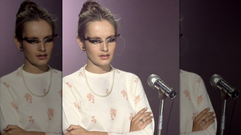 Twiggy speaking into microphone