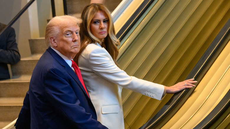Melania Trump looking at Donald Trump as the escalator stops at the U.N. General Assembly