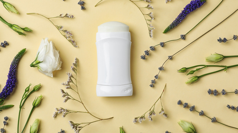 unlabeled deodorant surrounded by flowers