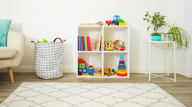 room with organized toys on shelves and in bins