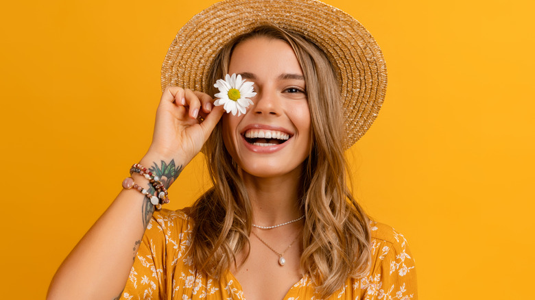 Girl with hat and a flower