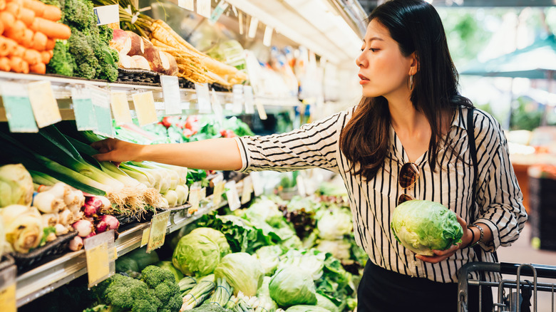 Woman shopping for fresh vegetables