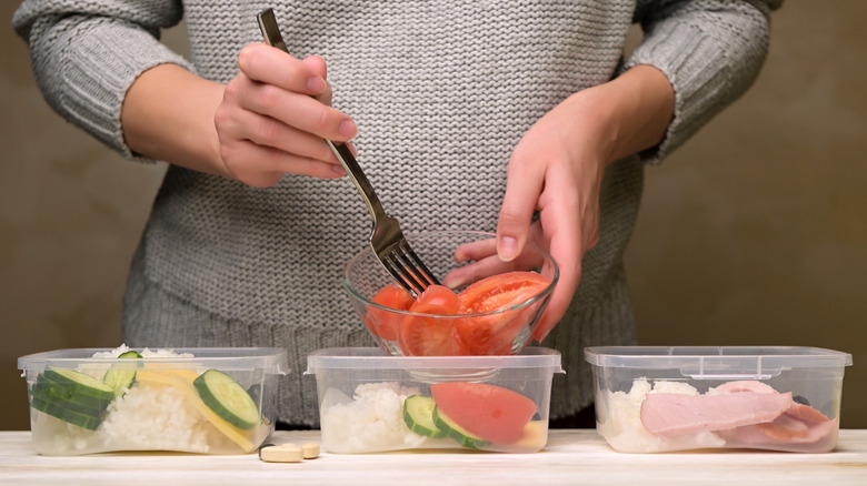 Woman preparing simple meals for the day ahead