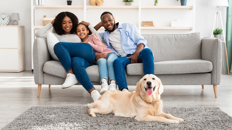 Family at home with dog