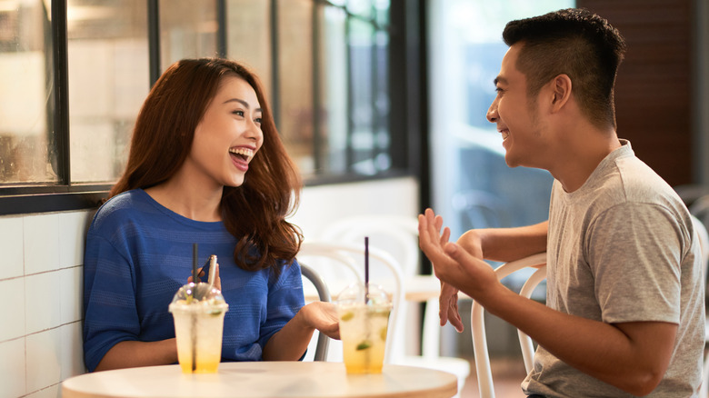 Couple laughing on a date