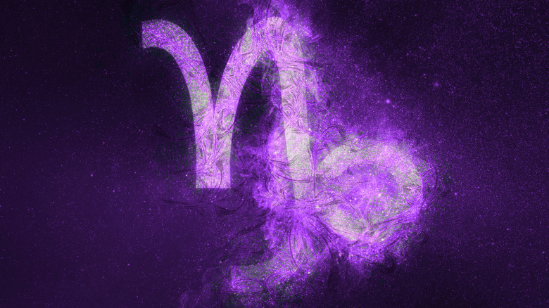 Purple Capricorn symbol in night sky