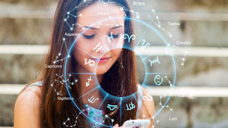 Woman on phone with astrological chart