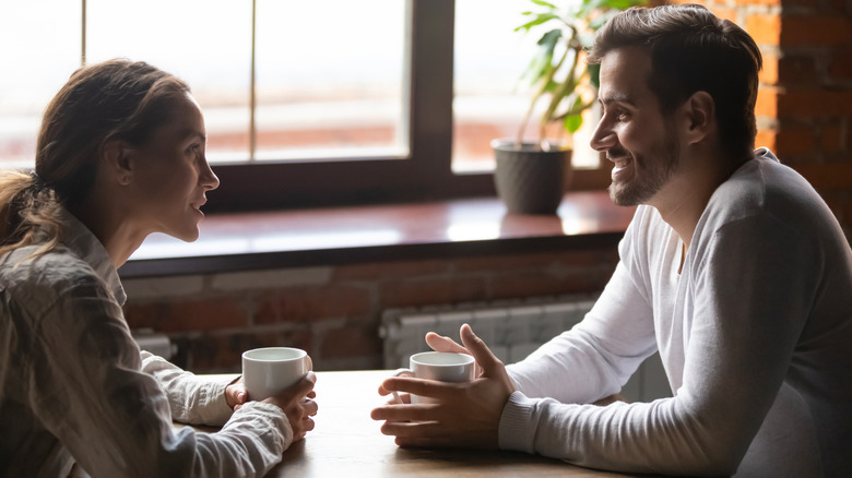 Couple talking over coffee