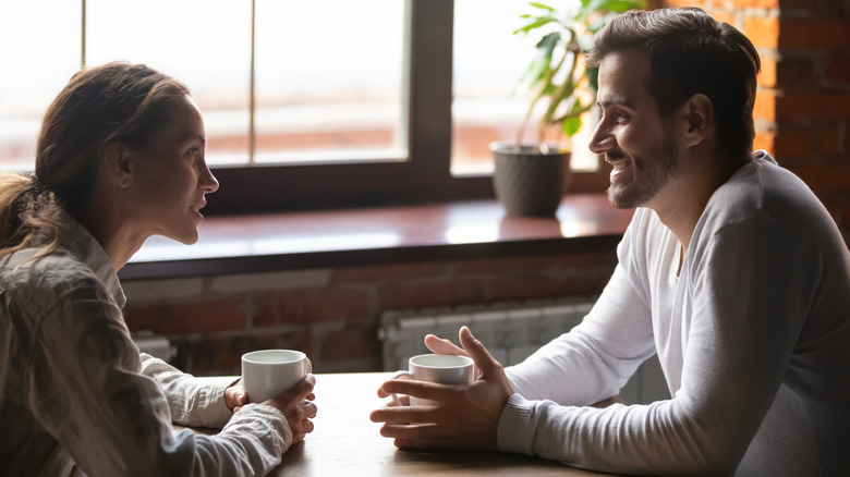 Couple talking over coffee