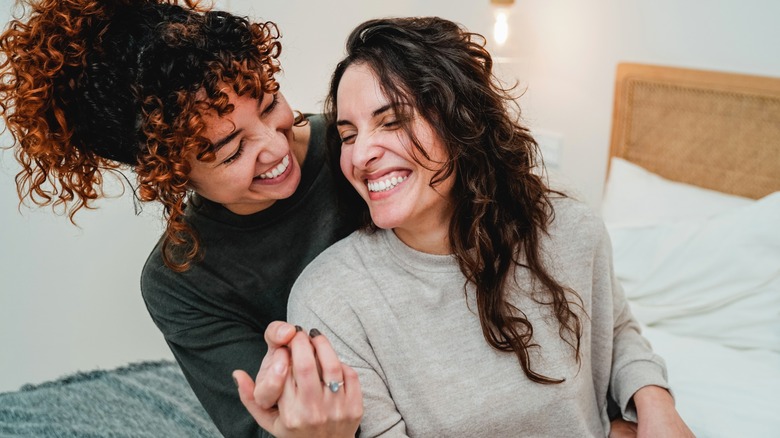 a gay couple smiling