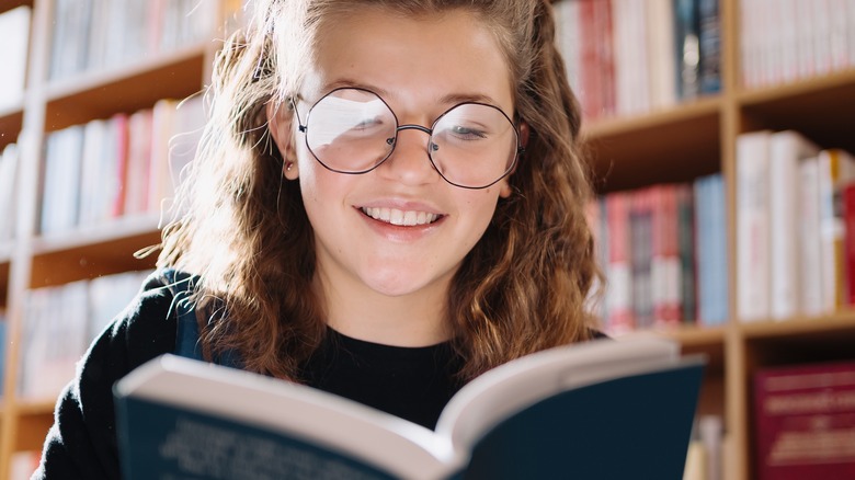 Adolescent reading a book