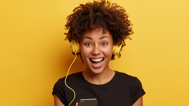 Woman excited about music