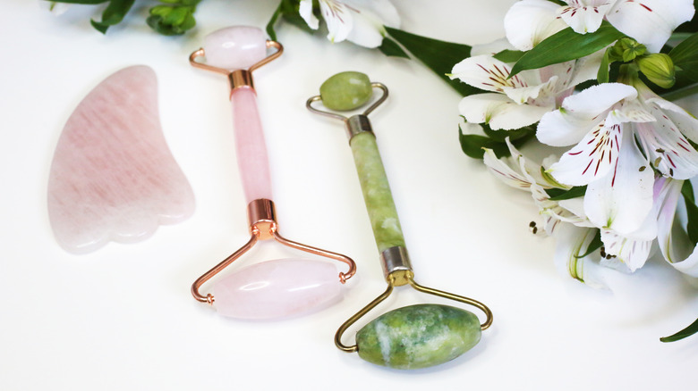 Rose quartz and jade rollers, plus a gua sha