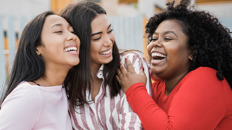 Three friends laughing 