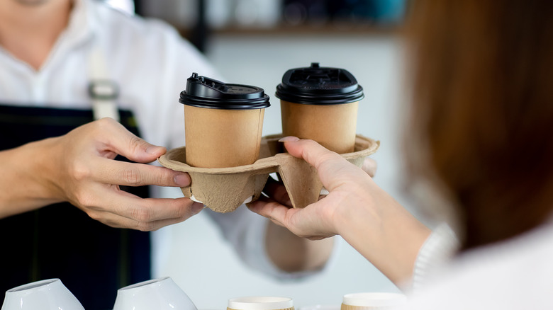 Woman receiving her coffee order