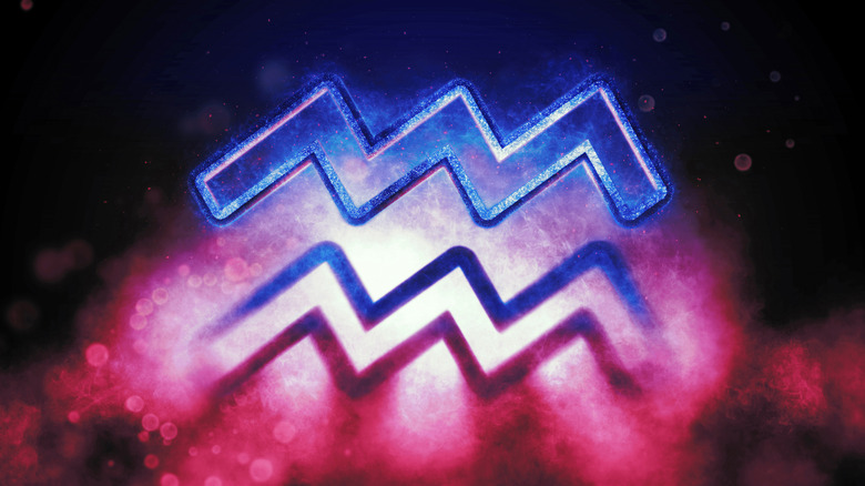 Blue and purple Aquarius symbol in night sky