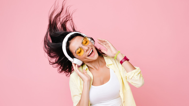 Woman dancing to music