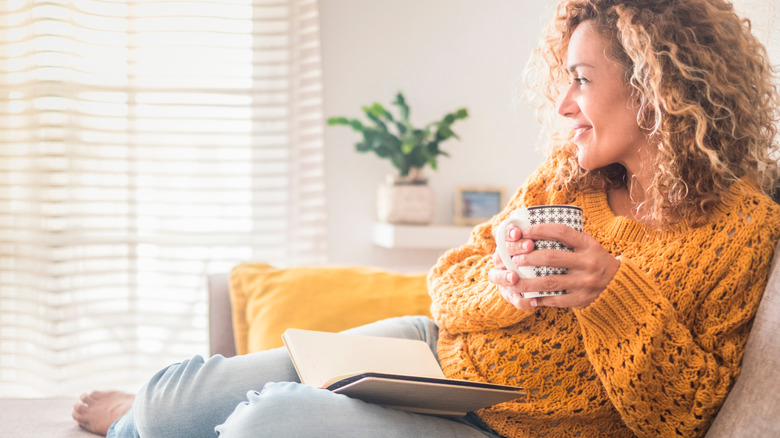 woman with a book and coffee