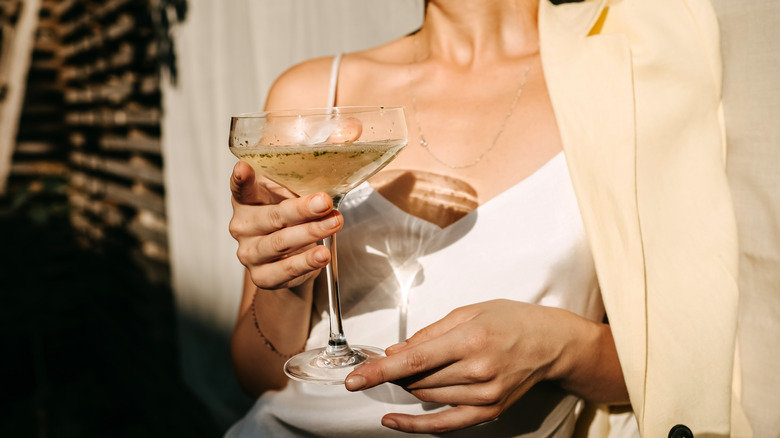 Woman holds a cocktail